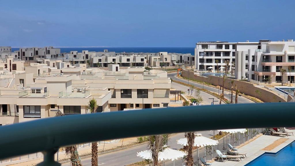 Ad-Dab'ah Apartment | Elegant Stay Pool & Sea View at June Ras El Hekma