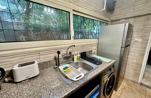 Heliopolis Apartment | Premium 1BR Heliopolis Suite | Private Garden Terrace & A/C