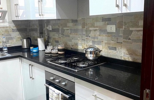 Al Rehab Apartment | Stylish & Cozy ~ 5* Location ~ King Beds ~ Balcony