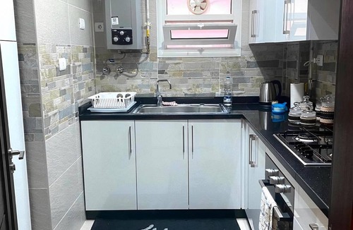 Al Rehab Apartment | Stylish & Cozy ~ 5* Location ~ King Beds ~ Balcony