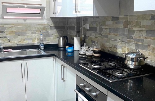 Al Rehab Apartment | Stylish & Cozy ~ 5* Location ~ King Beds ~ Balcony