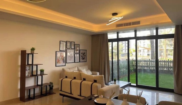 Access - lux smart home with garden at cfc 2bedr in Mivida New Cairo