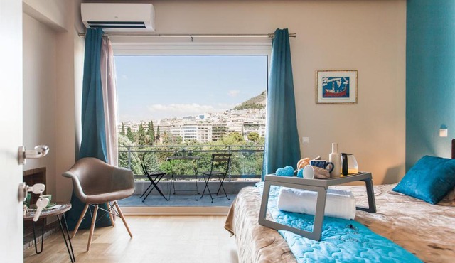 Central high-class and safe rooms next to Metro Airport Line with Acropolis View from balcony in Athens