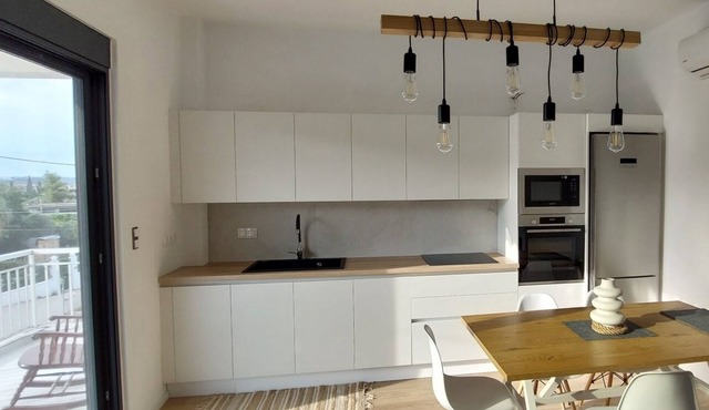 Elegant summer residence with big balcony and garden. Can host 8-10 adults. in Kato Almiri
