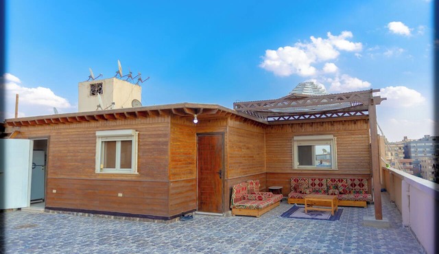 Spacious 2-bedroom apartment with Rooftop between GEM and Giza Pyramids in Giza Governorate