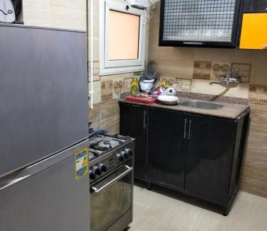 New Cairo Hostel | Room 2 in a three-room apartment in the Fifth Settlement compound, with air conditioning