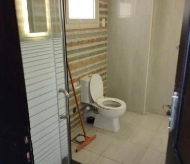 New Cairo Hostel | Room 2 in a three-room apartment in the Fifth Settlement compound, with air conditioning