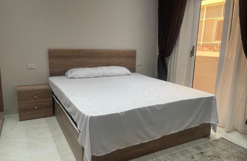 Al Mamsha El Seyahi Apartment | marvel white apartment