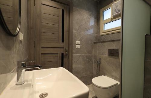 Sheikh Zayed City Apartment | v1Relaxing Modern Stay with Private Garden, Sheikh Zayed city